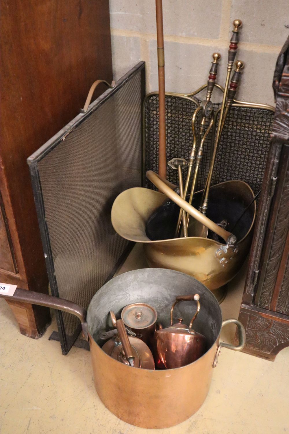 A collection of Victorian copper and brass items, including a large copper saucepan